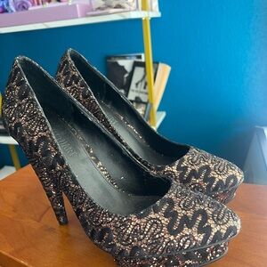 Colin Stuart Black and Gold Heels with platform silhouette